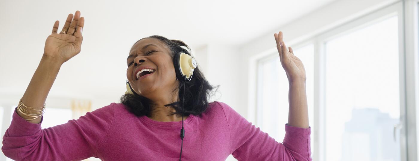 image_of_woman_with_headphones_singing_GettyImages-514411047_1800
