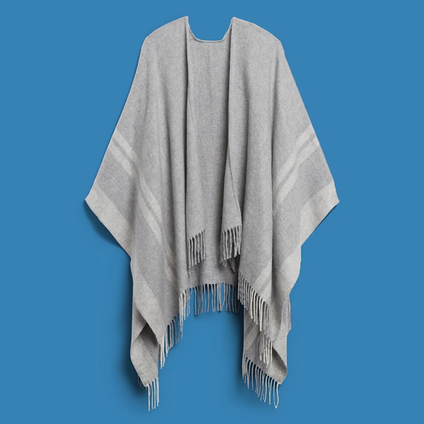 Banana Republic grey poncho with stripe on blue background