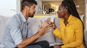 Black woman and man quarreling at home