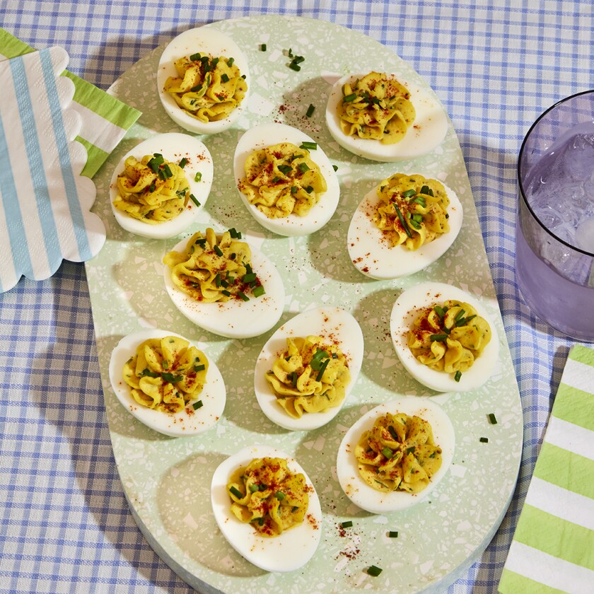 Overhead of classic deviled eggs on check background cloth