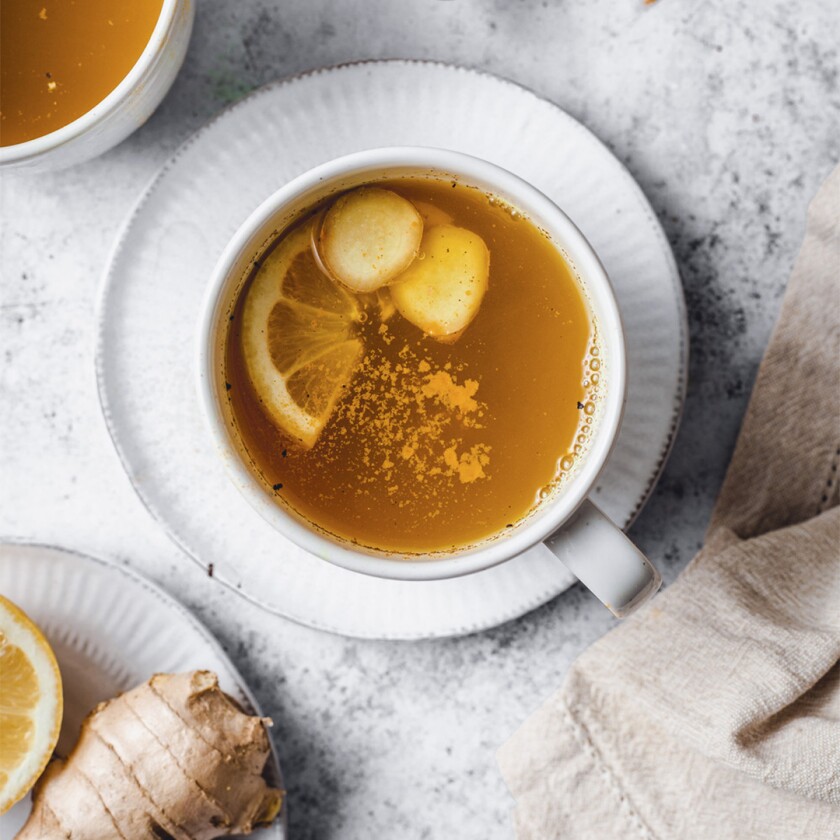 Ginger tea with a ginger root and lemon
