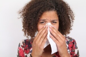 Woman sneezing