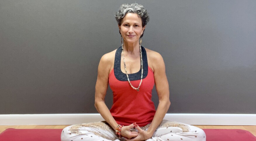  Julie Blamphin sitting on yoga mat