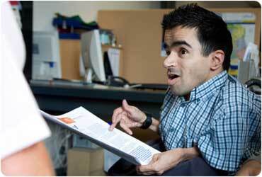 disabled working man holding report