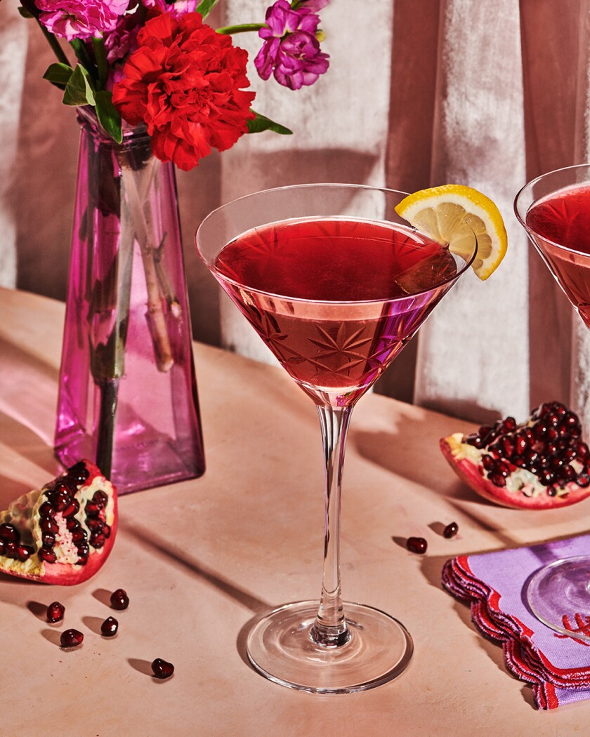 Pomegranate martini with a vase and carnation for libido boosting menu for Valentine’s Day