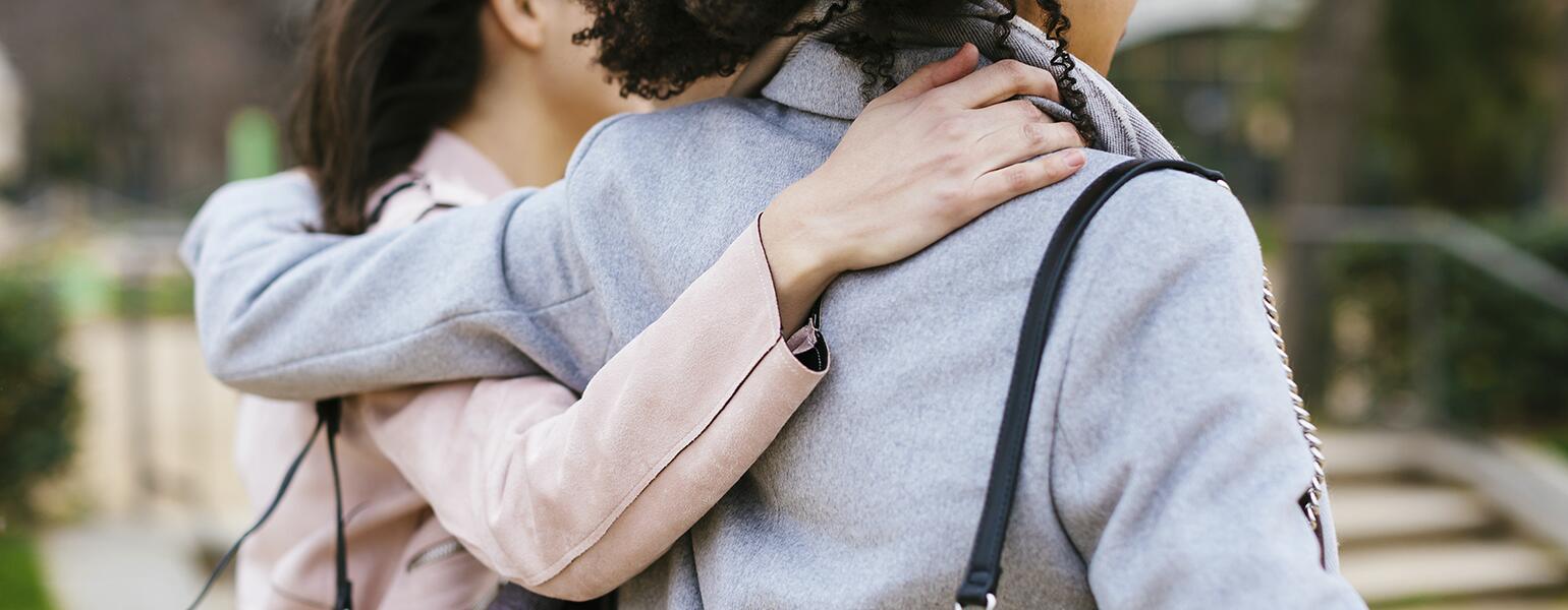 two best women friends with their arms around each other