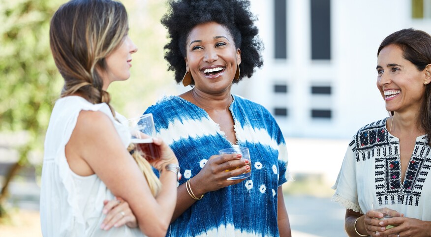 Group Of Women Friends Enjoying Cocktails At An Outdoor Party