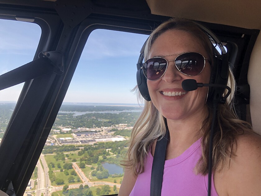 Author Heather Sweeney Skydiving, in a helicopter and paragliding