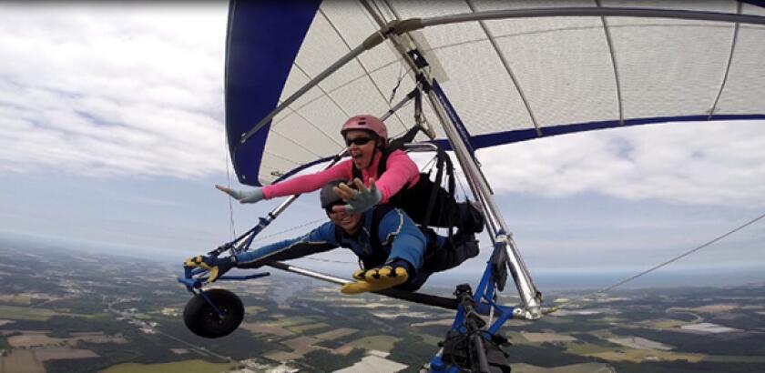 Author Heather Sweeney Skydiving, in a helicopter and paragliding