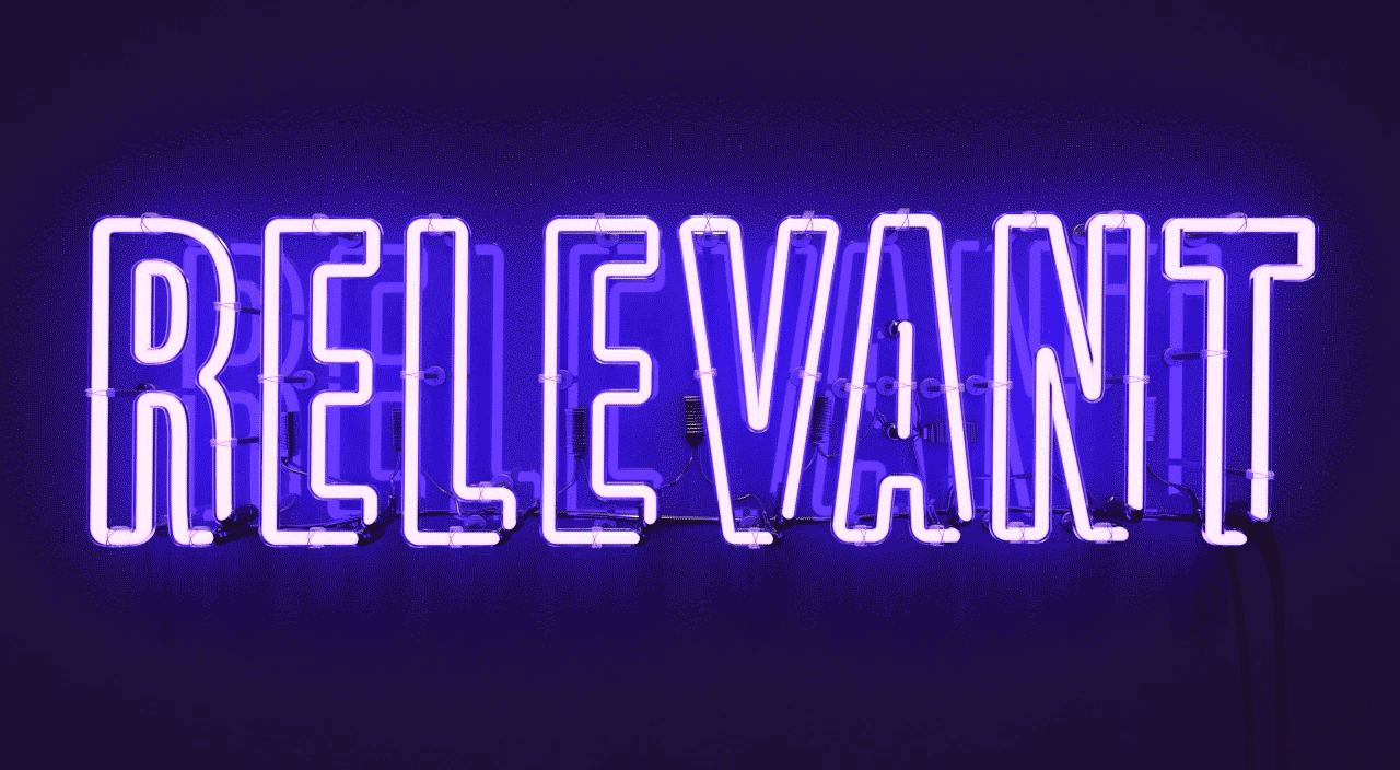 gif of neon lights flashing spelling the word relevant