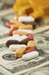 Pills on top of hundred dollar bill