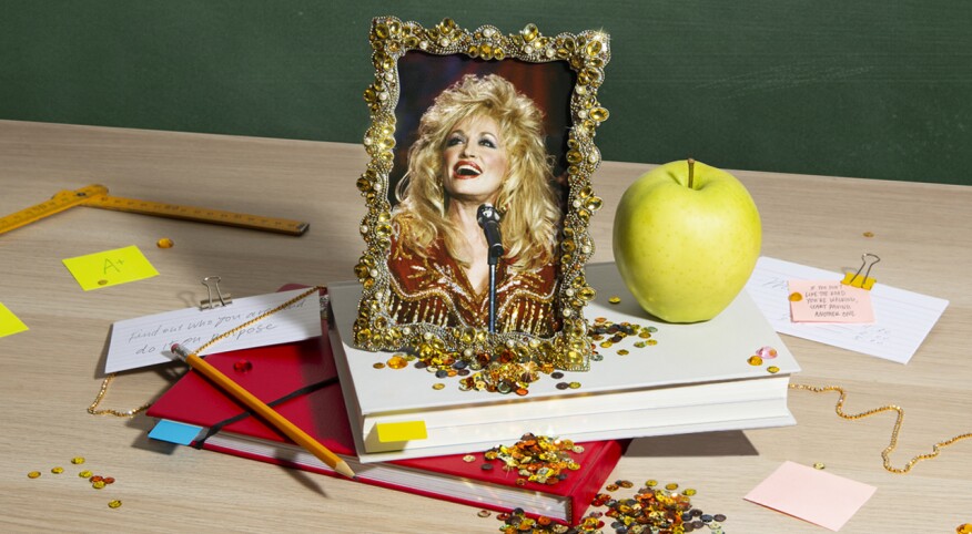 photo of items on table with Dolly Parton image in gold elaborate picture frame