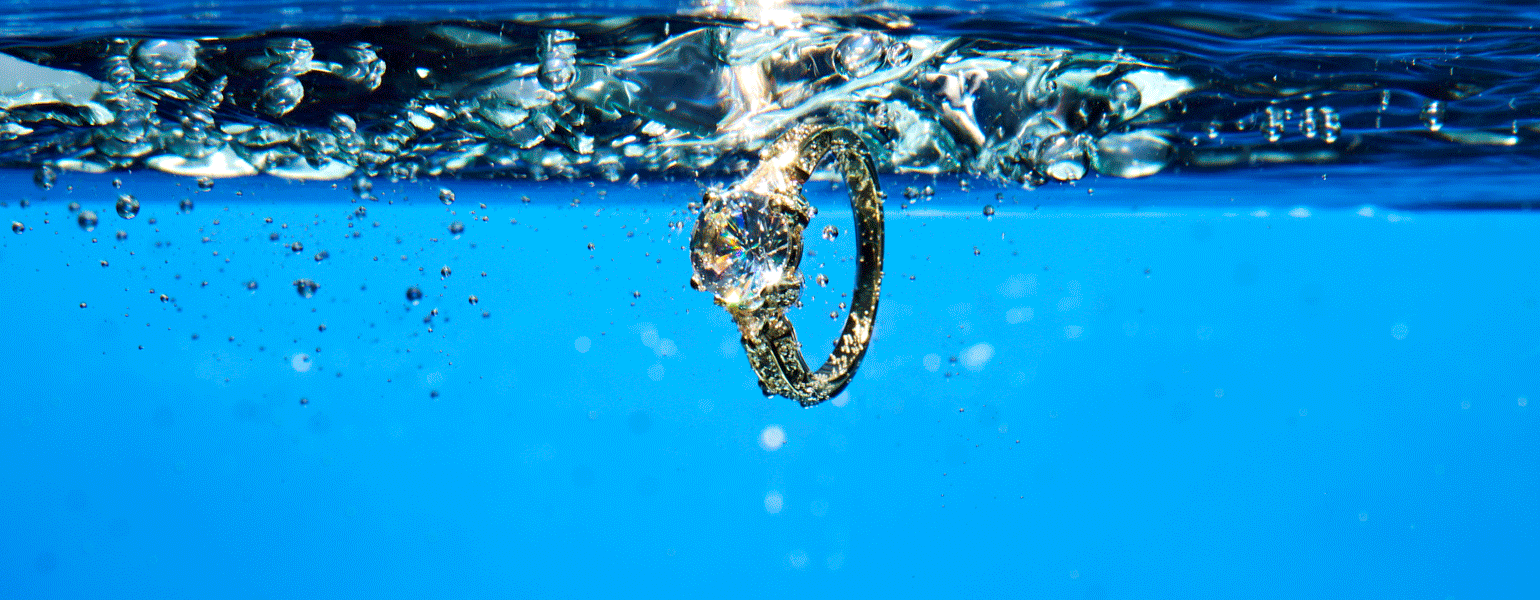A GIF of a ring falling into water and then sinking