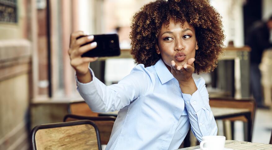 image_of_african_american_woman_taking_selfie_with_phone_GettyImages-946920772_1540