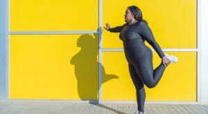 Woman doing quad leg stretch