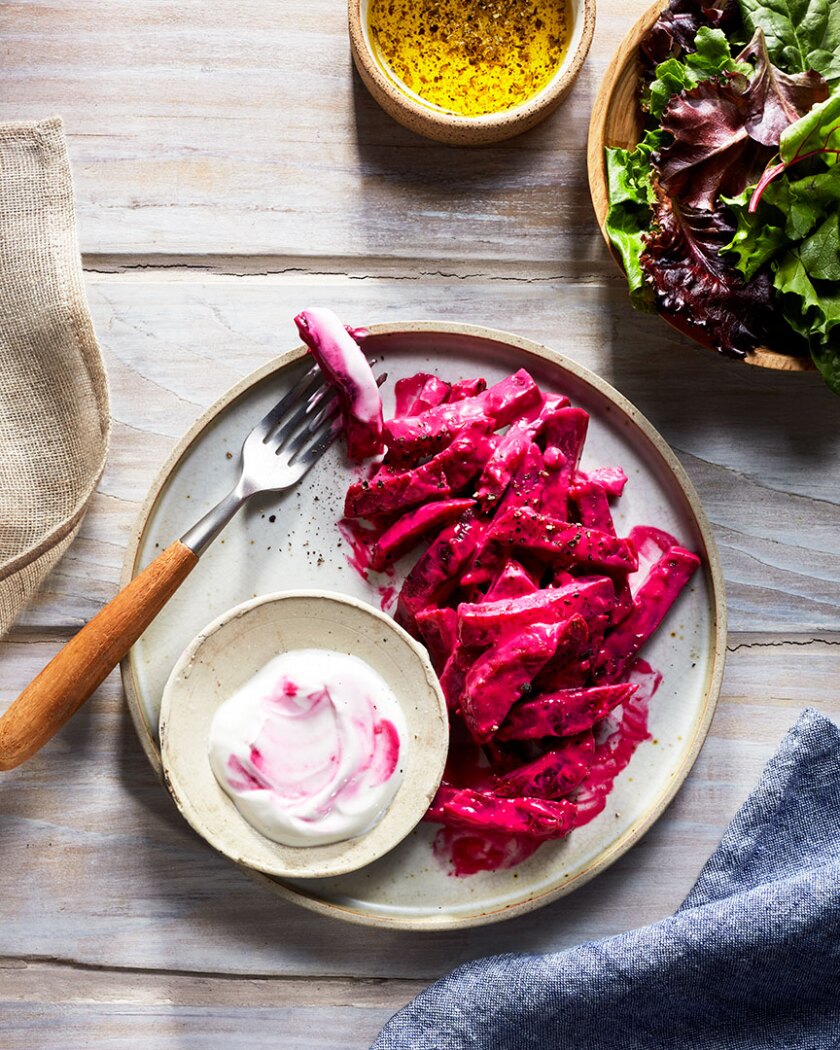 Root vegetable recipe styled on autumnal rustic background