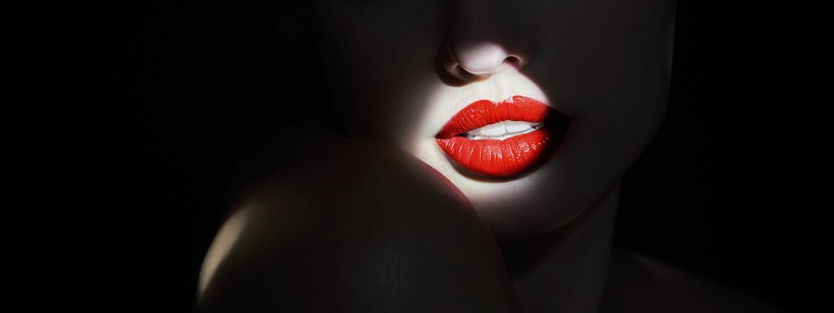 Spotlight on woman with red lipstick