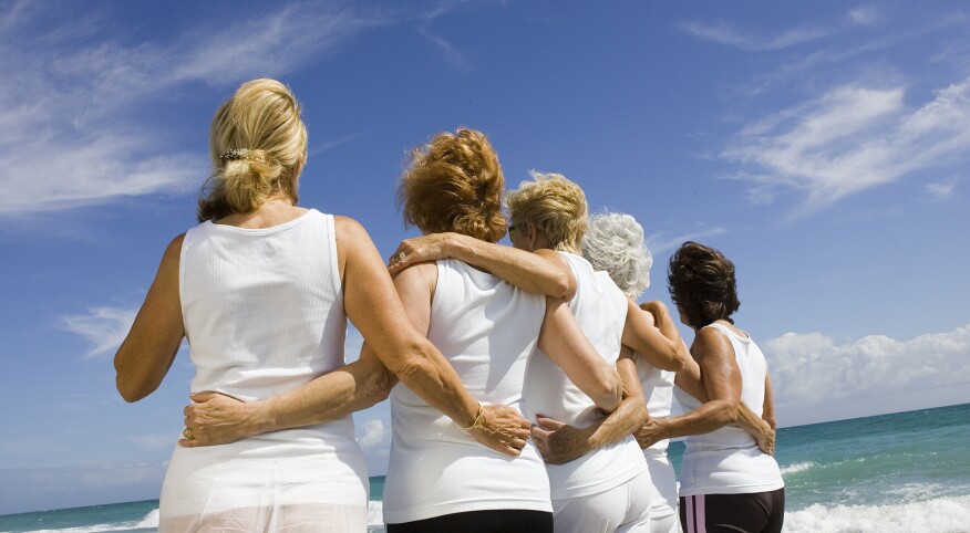 Rear view of group of senior women at beach