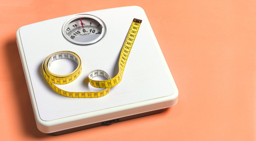 Text lose weight with weigh scale and measure tape