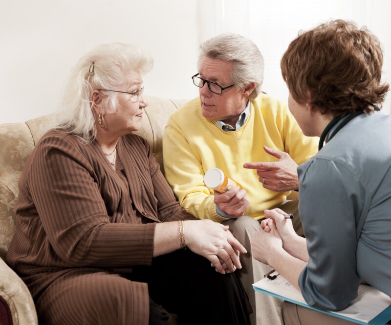 Doctor Discussing Medication with Senior Couple