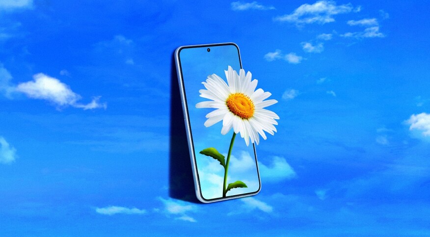 photo collage of blue sky with flower emerging from phone screen