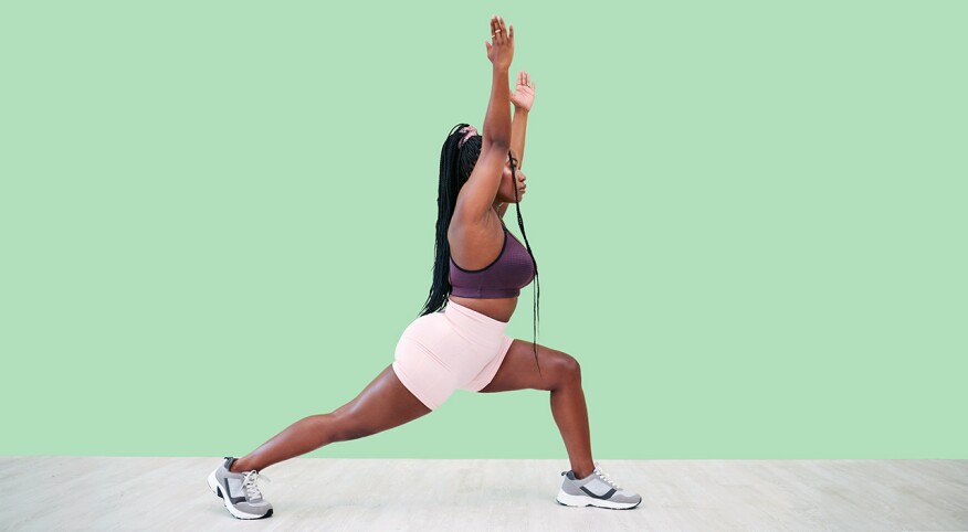 Woman doing full body lunges in a studio