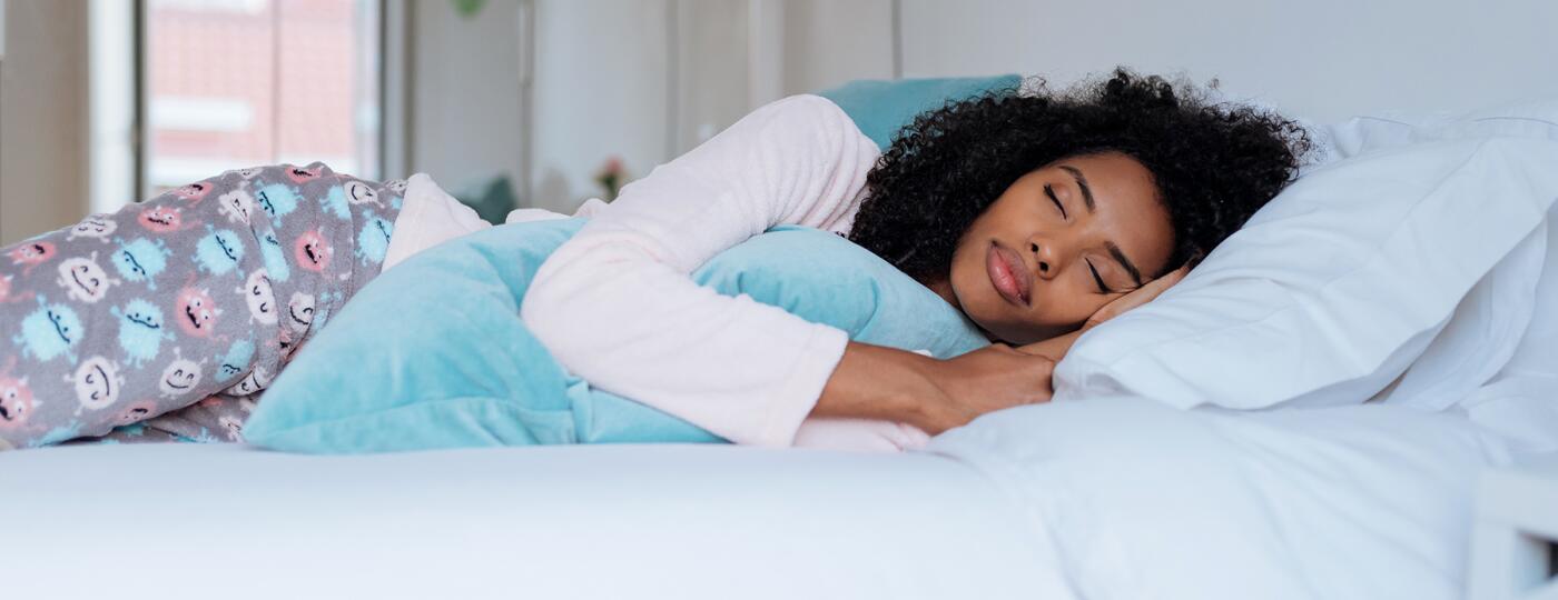 image_of_woman_sleeping_in_bed_GettyImages-896809536_1800