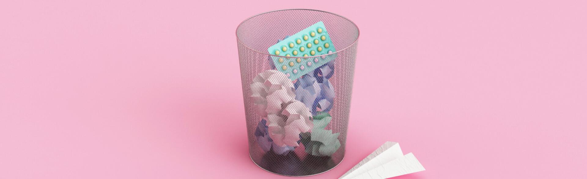 garbage can with birth control pill package in it