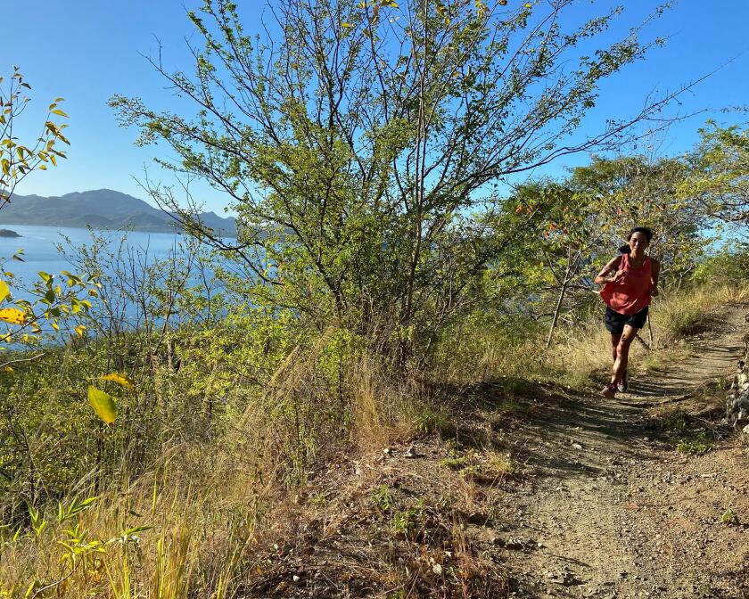Katherine Han running trails at Las Catalinas.jpg