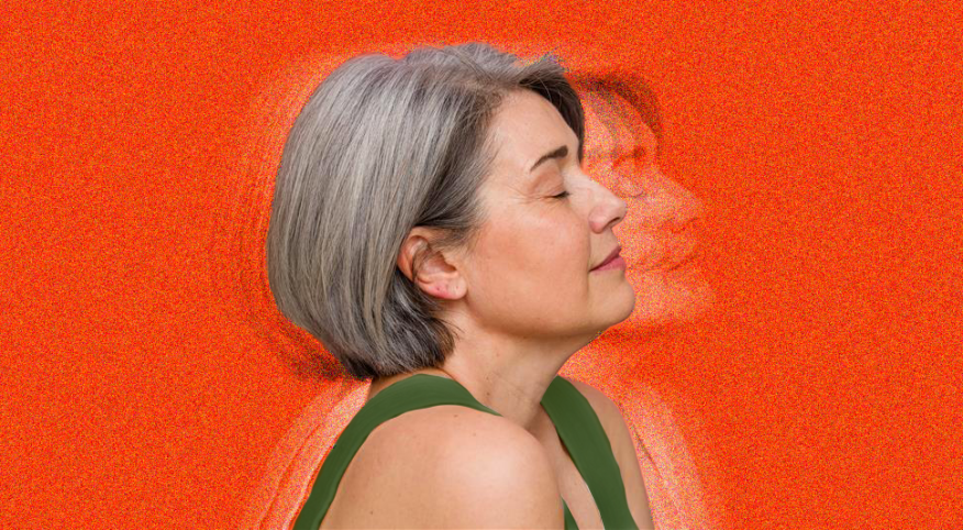 single woman, gray hair, on solid background, photograph