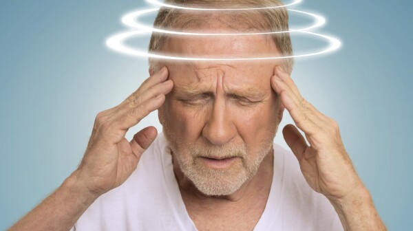 Headshot senior man with vertigo suffering from dizziness