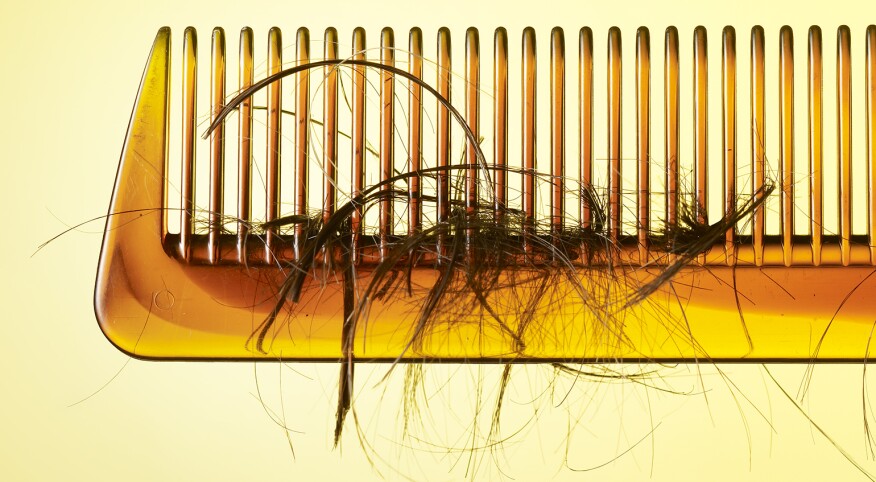 Comb with loose hair tangled in it