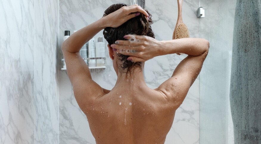 Woman Taking Shower At Home