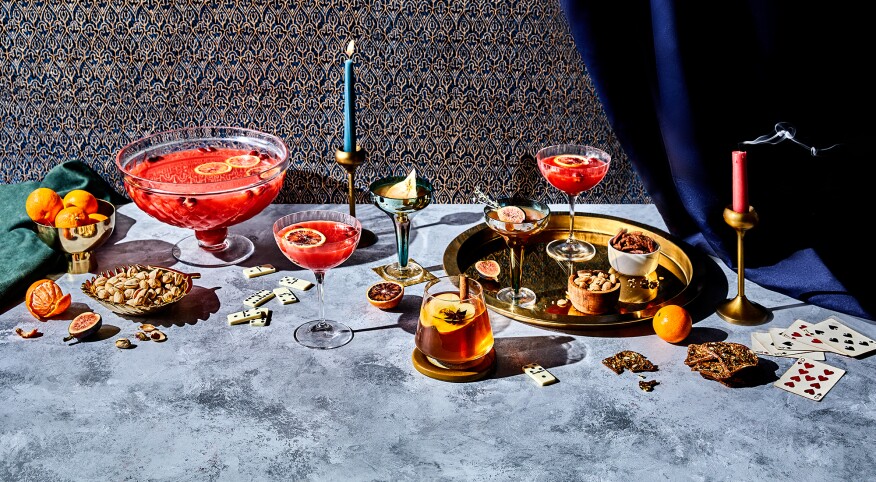 Holiday spread of cocktails and snacks on tabletop