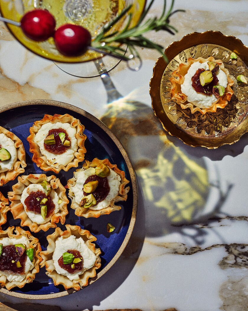 Fig Goat Cheese pinwheels on a decorated table set for the winter holidays