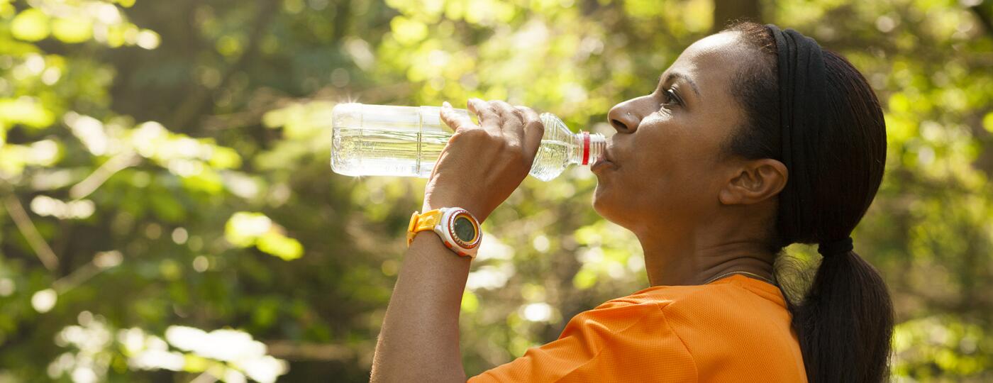 image_of_woman_outside_drinking_water_bottle_GettyImages-647249888_1800