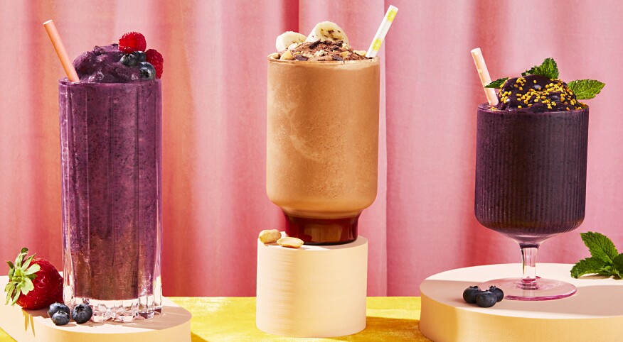 Smoothie drink styled in front of colorful background