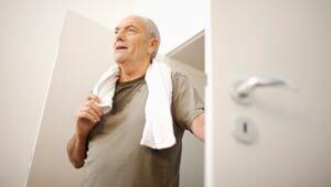 Man stands after exercising