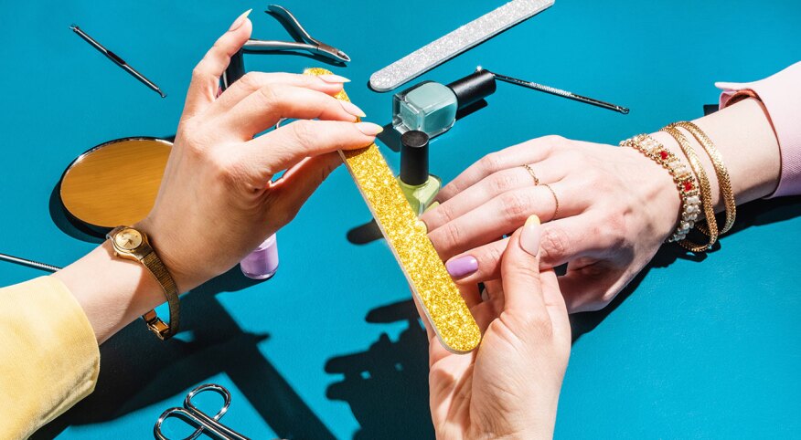 Fashionable stylish female hands doing manicure.