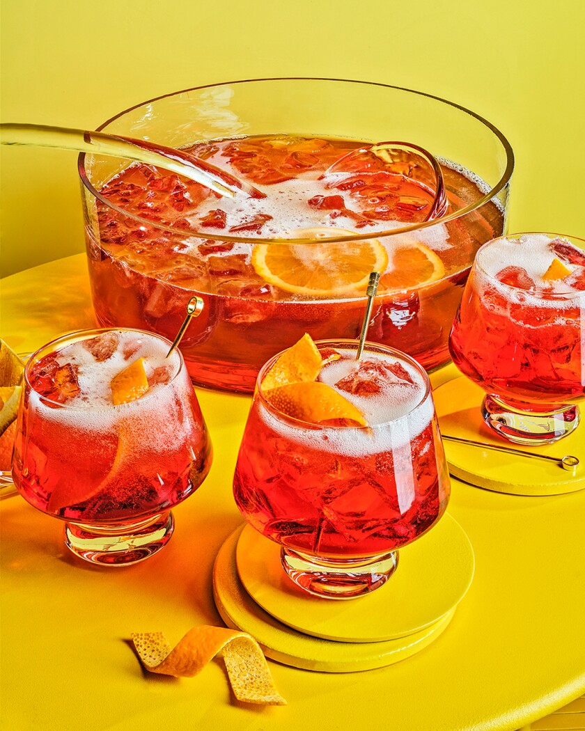 Negroni cocktails on bright yellow background 