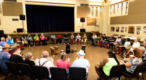image_of_group_of_people_sitting_in_a_large_circle_with_drums_and_instruments_DrumCirlces_SistersFromAARP_DeannaReid-7380_1540.jpg