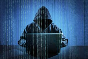 WiFi hacker using laptop
