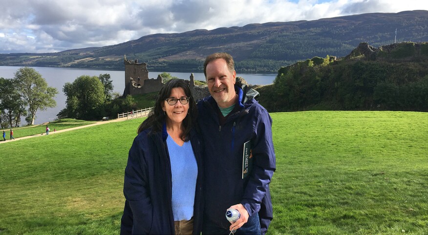 woman and man pose for photo