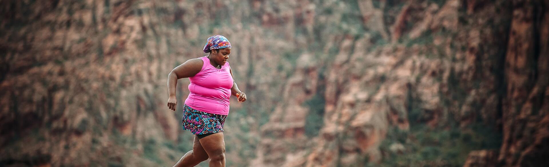 Plus size middle age woman running a marathon