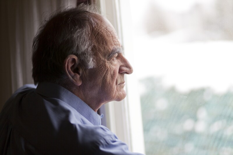 Man gazing out sad profile