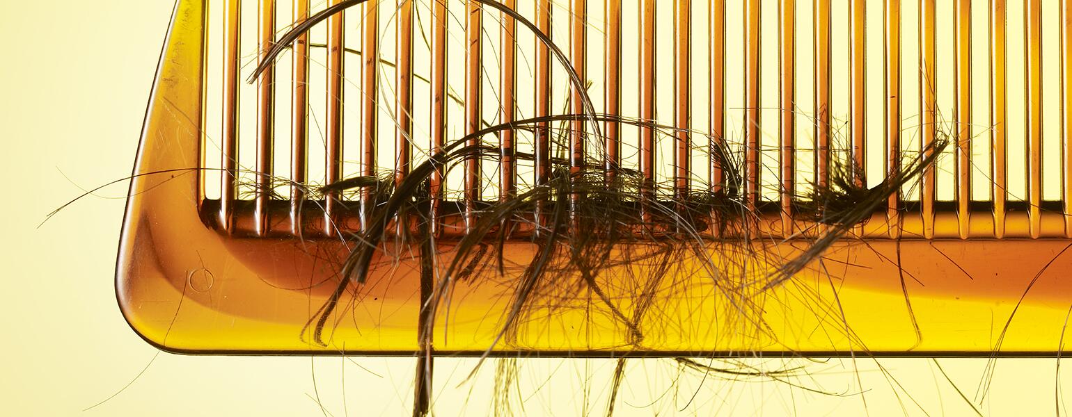 Comb with loose hair tangled in it