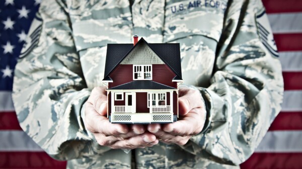soldier holding house