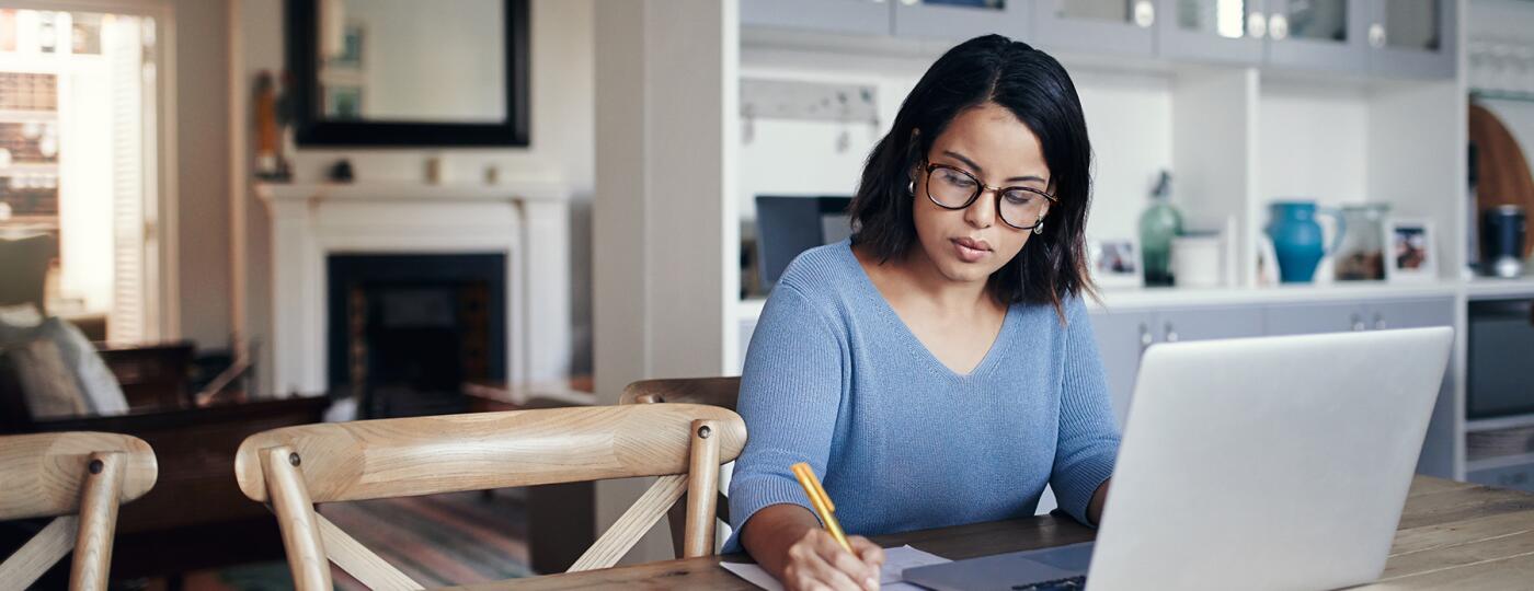 image_of_woman_working_at_desk_on_computer_GettyImages-875247416_1800