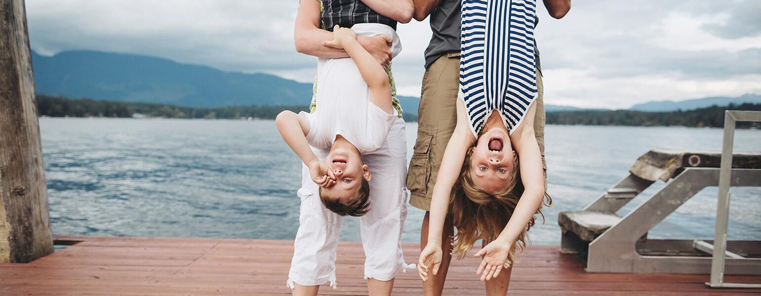 parents hanging out with their kids at a dock