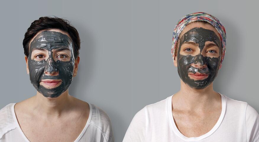 two women with magnetic face masks on